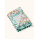 Reversible baby blanket featuring a floral design on one side and a soft, mint green satin border.