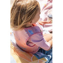 Kalencom Saro pink swim vest on a child, featuring cute aquatic designs, providing safety and comfort by the water.