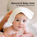 White baby wash cloths displayed on a soft surface, with a baby’s face partially covered by a cloth, highlighting its gentle use.