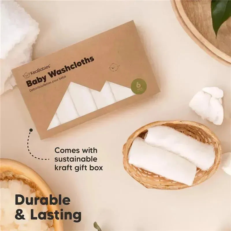 Keababies 6-pack baby washcloths in a kraft gift box with soft, white cloths displayed in a basket, emphasizing durability.