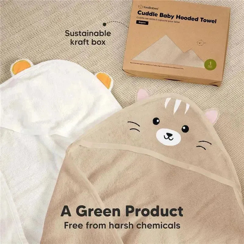 Hooded baby towel in cat design, featuring a cream color with facial details and a sustainable kraft box.