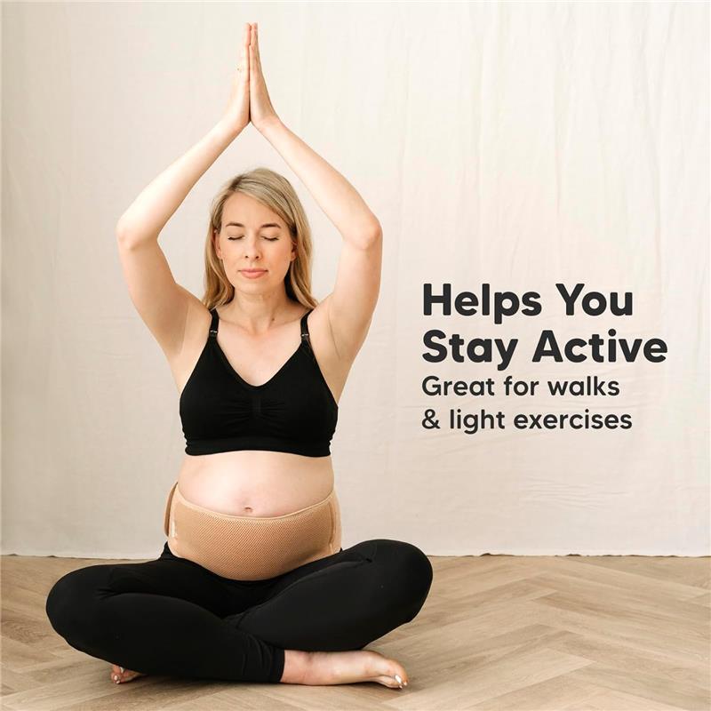 Maternity belly band by KeaBabies worn by a pregnant woman in a yoga pose, promoting activity and light exercises.