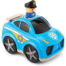 Blue police car toy with a smiling police officer figurine on top, featuring a badge design and moveable wheels.