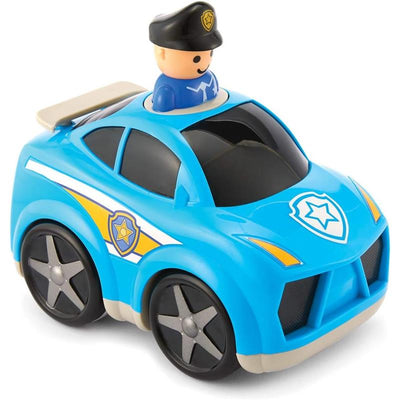 Blue police car toy with a smiling police officer figurine on top, featuring a badge design and moveable wheels.