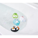Colorful water-squirting animal toys including a penguin, seal, bear, and frog, splashing in a tub of water.