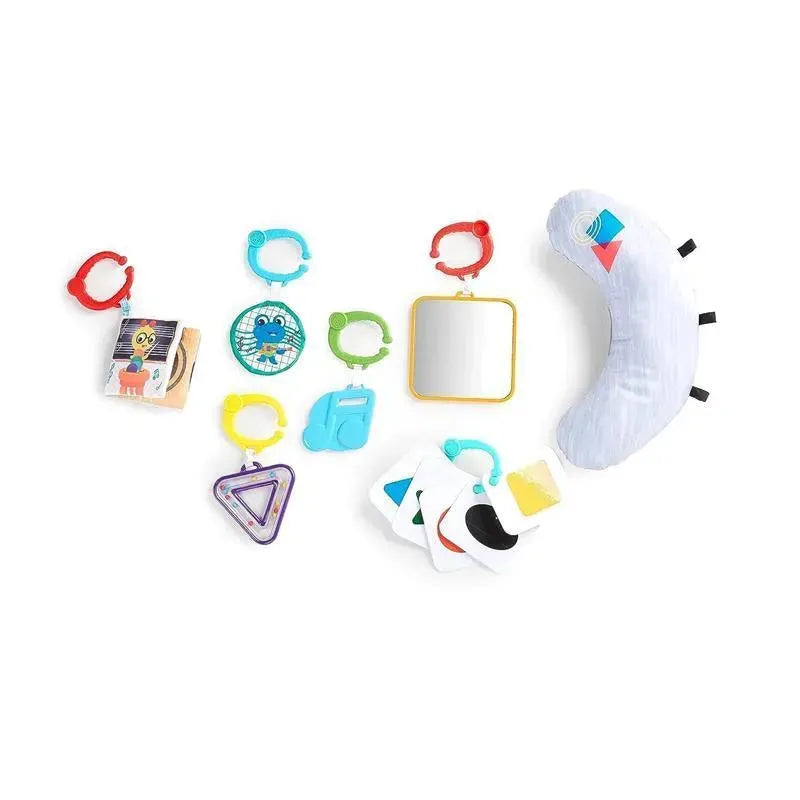 Colorful baby toys and hanging accessories including mirrors, soft shapes, and interactive cards from the Baby Einstein gym.