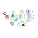 Colorful baby toys and hanging accessories including mirrors, soft shapes, and interactive cards from the Baby Einstein gym.
