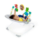 Comfy baby bouncer seat with soothing vibration, featuring colorful toys and a mirror, with an infant comfortably playing.