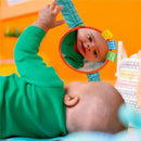 Bright Starts Wild Wiggles Activity Gym with a baby reaching for a mirror and colorful toys in a vibrant setting.