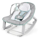Vibrating baby bouncer in gray and mint, featuring an elephant toy and a plush head support for comfort.