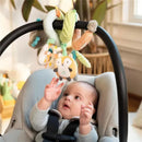 A baby reaches for colorful plush toys hanging from a black activity bar of the Kids II Nally & Friends Spiral Activity Toy.