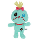 Cute teal plush doll with a red stitched mouth, black and blue buttons for eyes, a bow, and a crown.