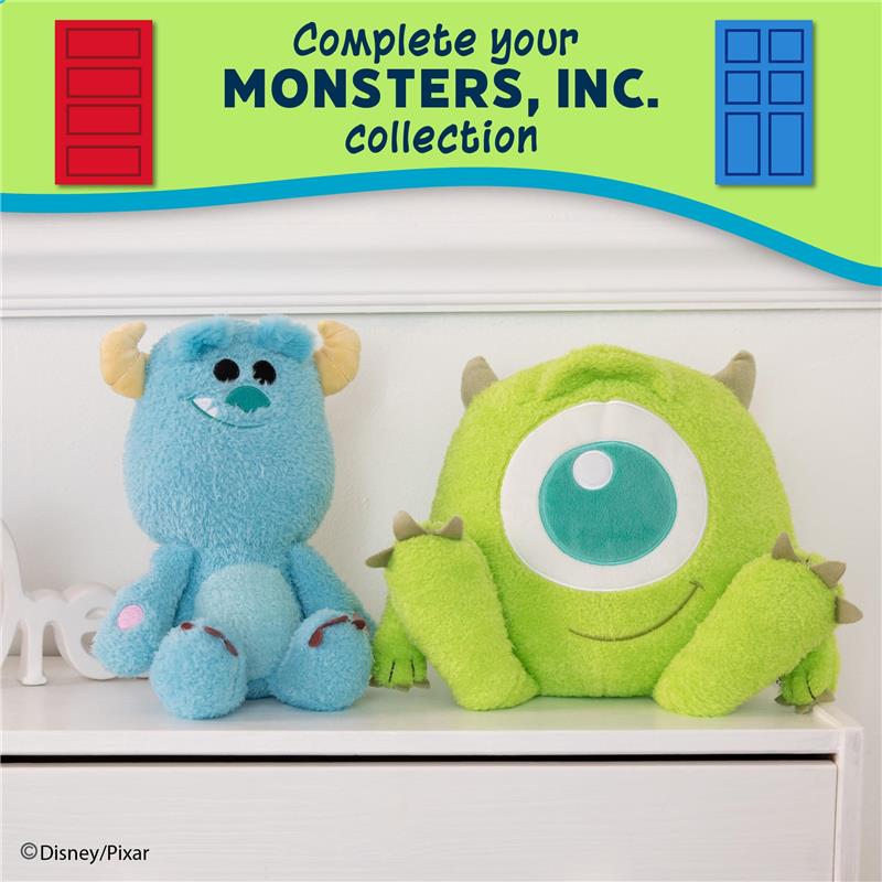 Disney Baby Monsters Inc. plush toys featuring a blue Sully and a green Mike, with a promotional banner for the collection above.