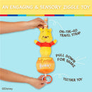 Winnie the Pooh plush toy attached to a travel strap, featuring a pulldown mechanism, teether rings, and activity details.