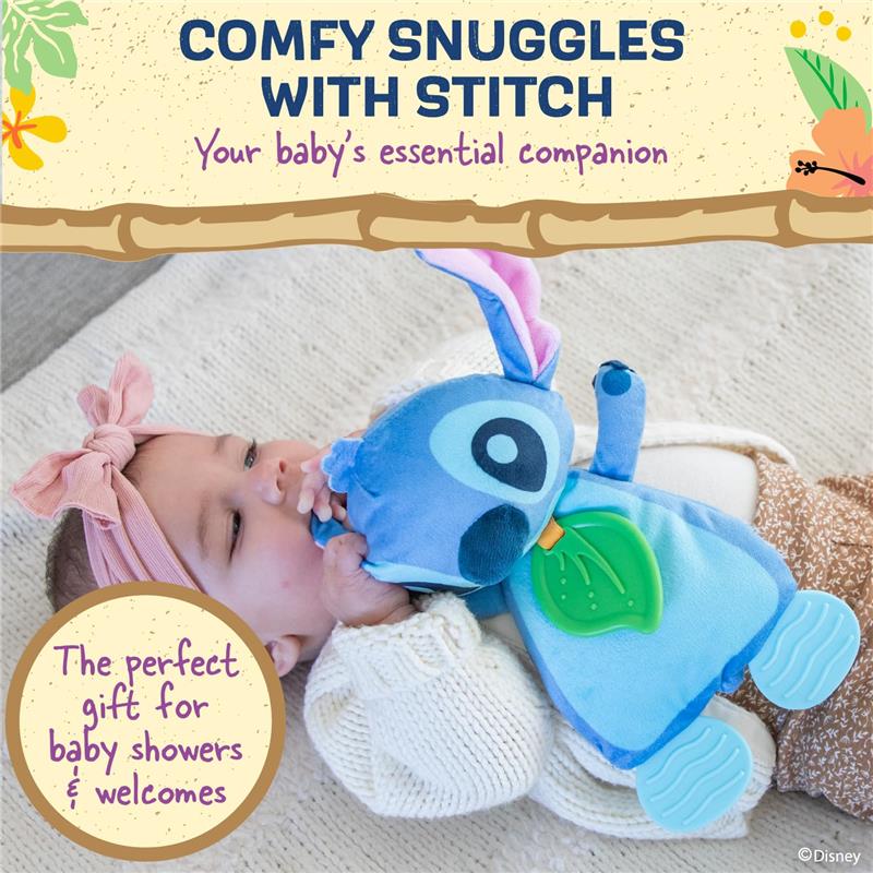 Baby cuddles a blue Stitch plush toy with sensory teething features, wearing a white sweater and pink headband.
