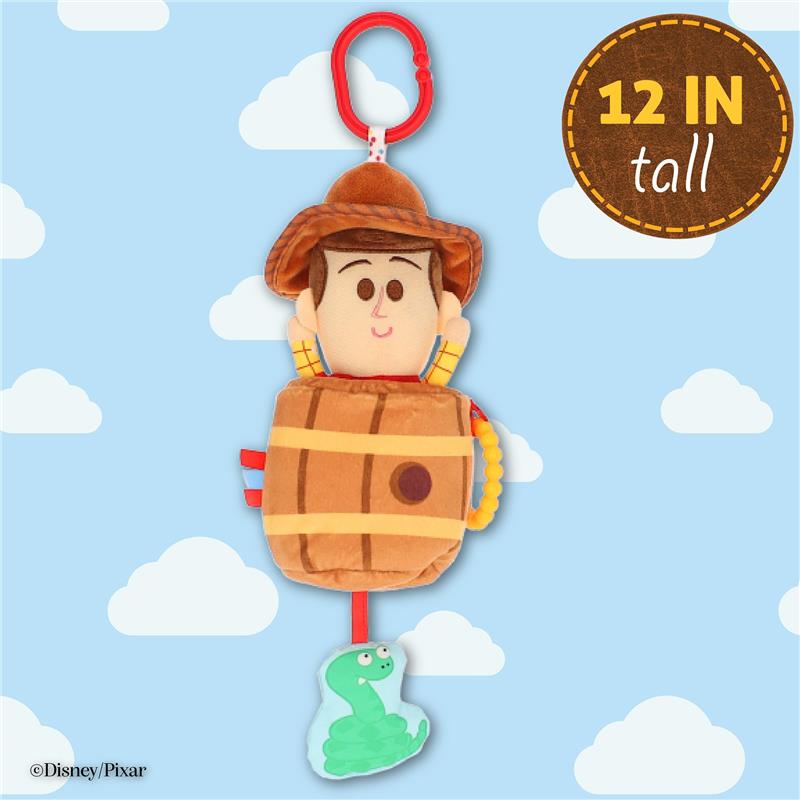 Plush Woody from Toy Story is shown in a barrel, 12 inches tall, with a clip and a green activity toy below.