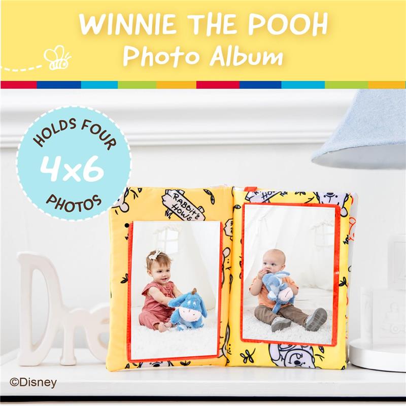 Disney Winnie the Pooh photo album featuring soft crinkle pages, holds four 4x6 photos, with images of children and Eeyore plush.
