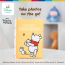 Disney Winnie the Pooh photo album with soft pages, crinkle sounds, and “MY FIRST PHOTO BOOK” text, featuring Pooh holding a jar.