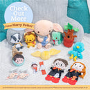 Harry Potter-themed soft toys, including Dobby, plush characters, and a golden snitch, displayed on a textured blanket.