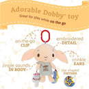 Dobby, the soft activity toy with jingle sounds, a clip for on-the-go use, and crinkle ears, promotes tactile play.