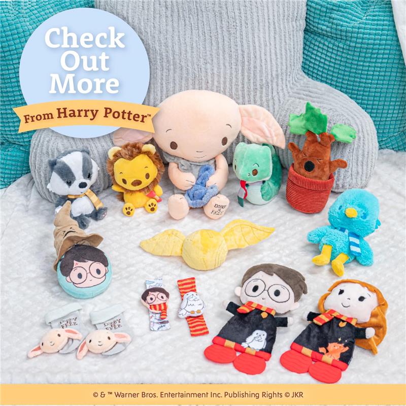 Dobby plush toy alongside colorful Harry Potter character plushies and sensory toys, arranged on a soft surface.