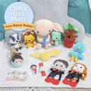 Harry Potter-themed plush toys including Dobby, a lion, a badger, and Harry and Hermione dolls, displayed on a soft blanket.