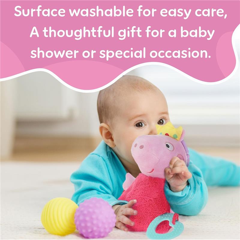 Soft Peppa Pig activity toy with fairy wings, surrounded by colorful balls, held by a smiling baby.