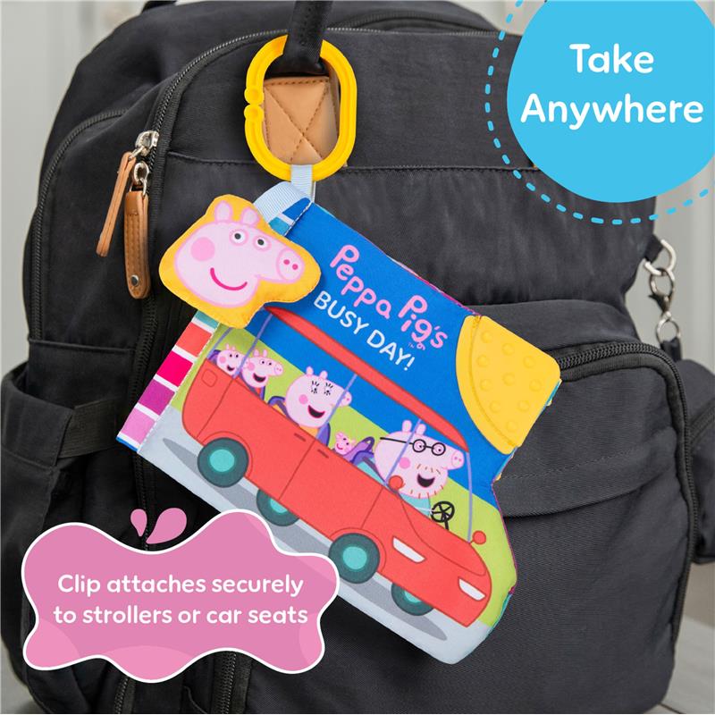 Peppa Pig soft book with ribbons, attached to a black backpack, illustrating a colorful design for children.