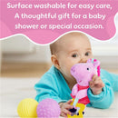 Child playing with Peppa Pig plush toy, surrounded by colorful sensory balls, with care instructions above.