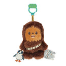 Cute plush Chewbacca toy with an attached clip, featuring a smiling face and holding a mini penguin and Millennium Falcon.