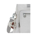 Kipling Alanna Baby Bag in Cool Fog with a furry monkey keychain attached to the zipper.