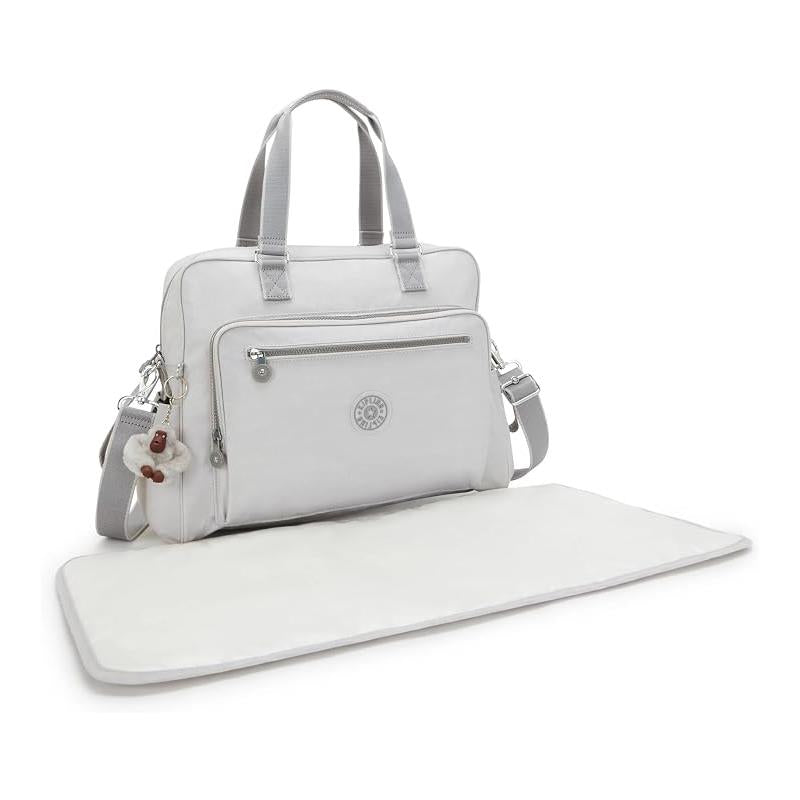 Kipling Alanna Baby Bag in Cool Fog with a front zip pocket and detachable shoulder strap, accompanied by a changing mat.