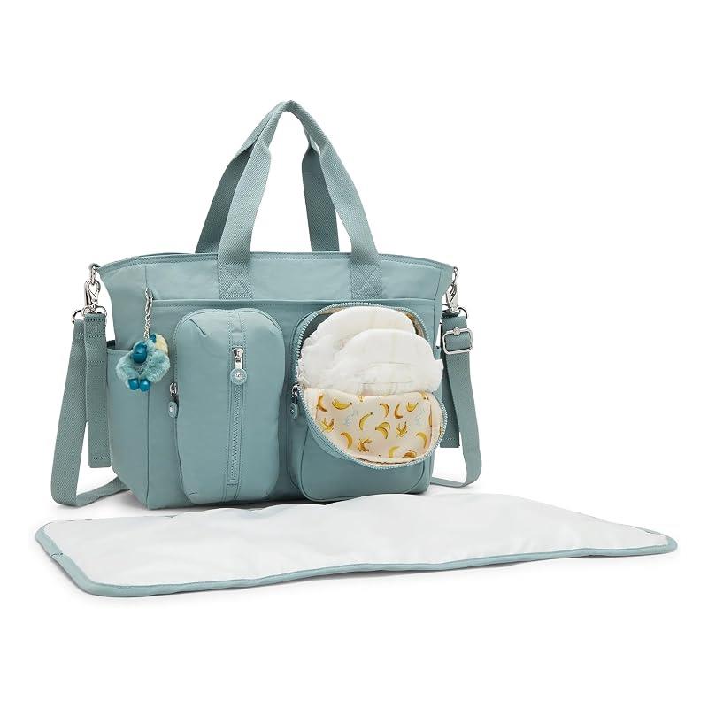 Convertible diaper backpack in Tiny Green Air, featuring multiple compartments, a changing pad, and a playful keychain.