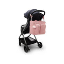Kipling Babygear Convertible Diaper Backpack in Tiny Smoky Blush attached to a stroller, featuring multiple pockets and a fluffy charm.