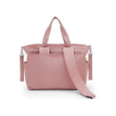 Convertible diaper backpack in Tiny Smoky Blush, featuring multiple pockets, adjustable straps, and a stylish design.