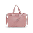 Convertible diaper backpack in Tiny Smoky Blush with two handles, adjustable strap, and multiple pockets for baby essentials.