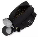Kipling Camama Diaper Bag in Tiny Black Noir, featuring a zippered opening and a patterned interior. Includes side pockets and a charm.