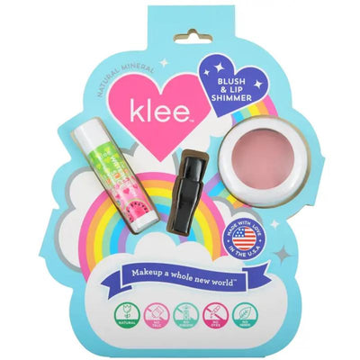 Blush and lip shimmer set featuring Klee Naturals products: a pink blush and two lip shimmers on a colorful cloud background.