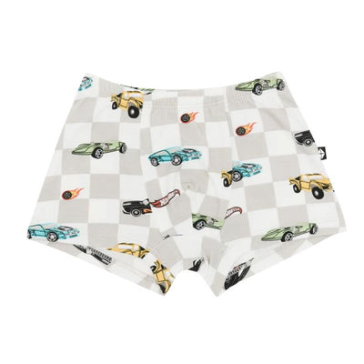 Baby boy briefs featuring colorful car patterns on a light checkered background, designed for comfort and style.