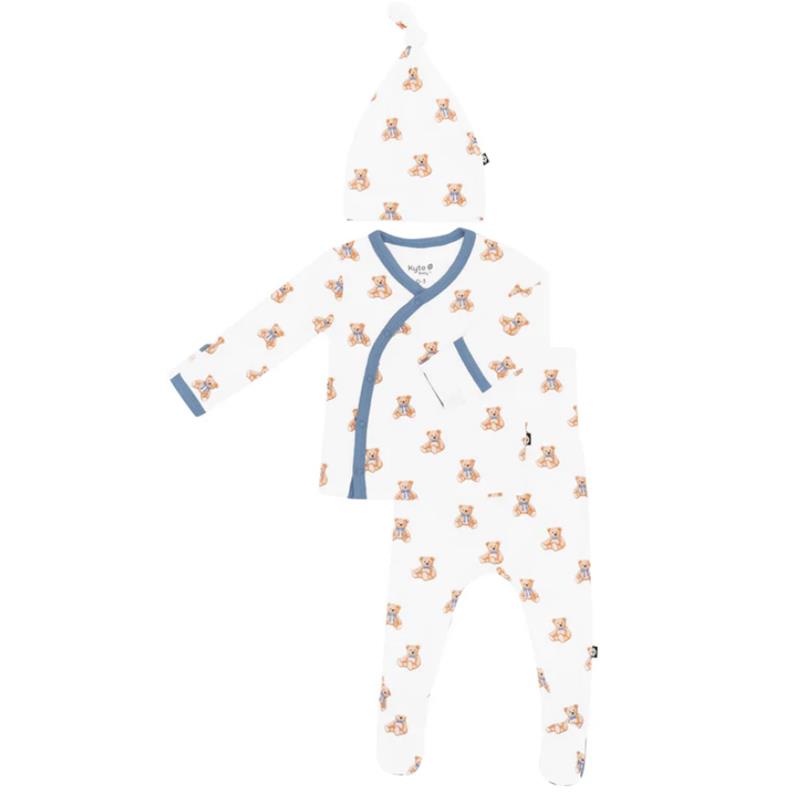 Baby girl take-me-home set featuring a teddy bear print, including a top, pants, and a matching cap.