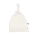 Bamboo baby knotted cap in oat color, featuring a knot at the top and a soft, lightweight material.