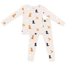 Neutral long sleeve pajamas for babies, featuring a fluffy dog pattern in various colors on a light background.