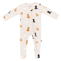 Baby neutral zippered footie featuring a fluffy dog design, showcasing various dog illustrations in orange, black, and white on a cream background.