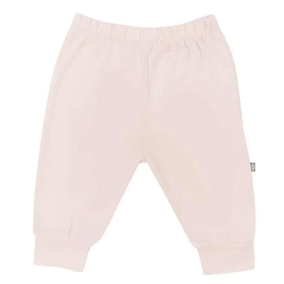 Blush-colored baby pants with an elastic waistband and gathered ankle cuffs, designed for comfort and style.