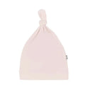 Bamboo baby knotted cap in blush color with a top knot detail, designed for infants.
