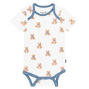 Short-sleeved white bodysuit featuring a playful teddy bear print, with a blue trim around the neckline and legs.