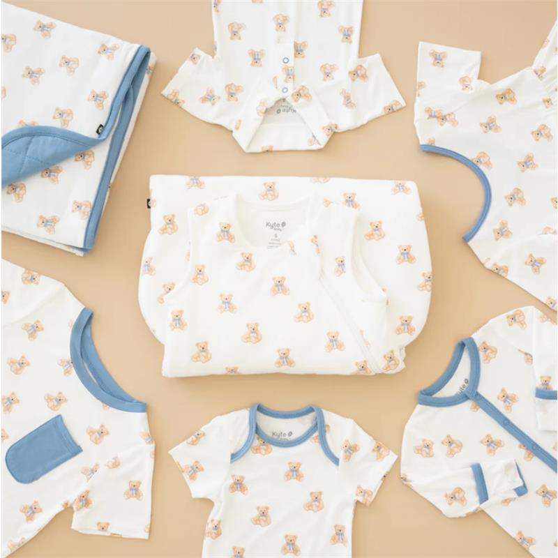 Kyte Baby bodysuits and blanket featuring a teddy bear print on a soft background.