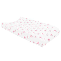 Change pad cover featuring a white background adorned with pink bow patterns, designed for infant changing tables.
