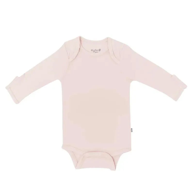 Long sleeve bodysuit in blush from Kyte Baby, featuring soft fabric and snap closures at the bottom.