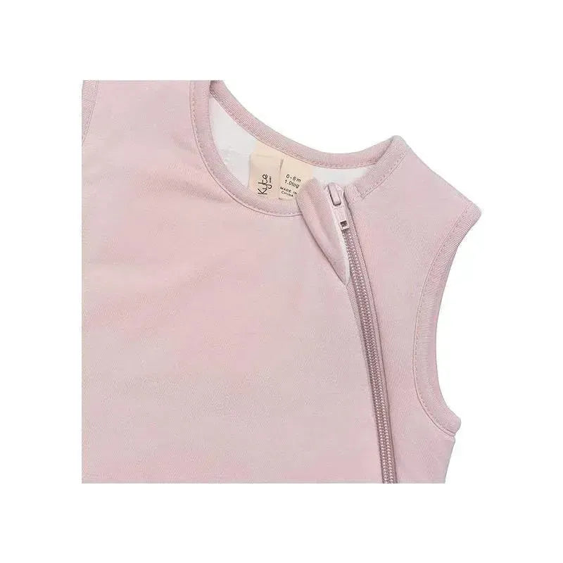 Bamboo sleep bag in blush color featuring a side zipper and a rounded neckline, designed for infants.